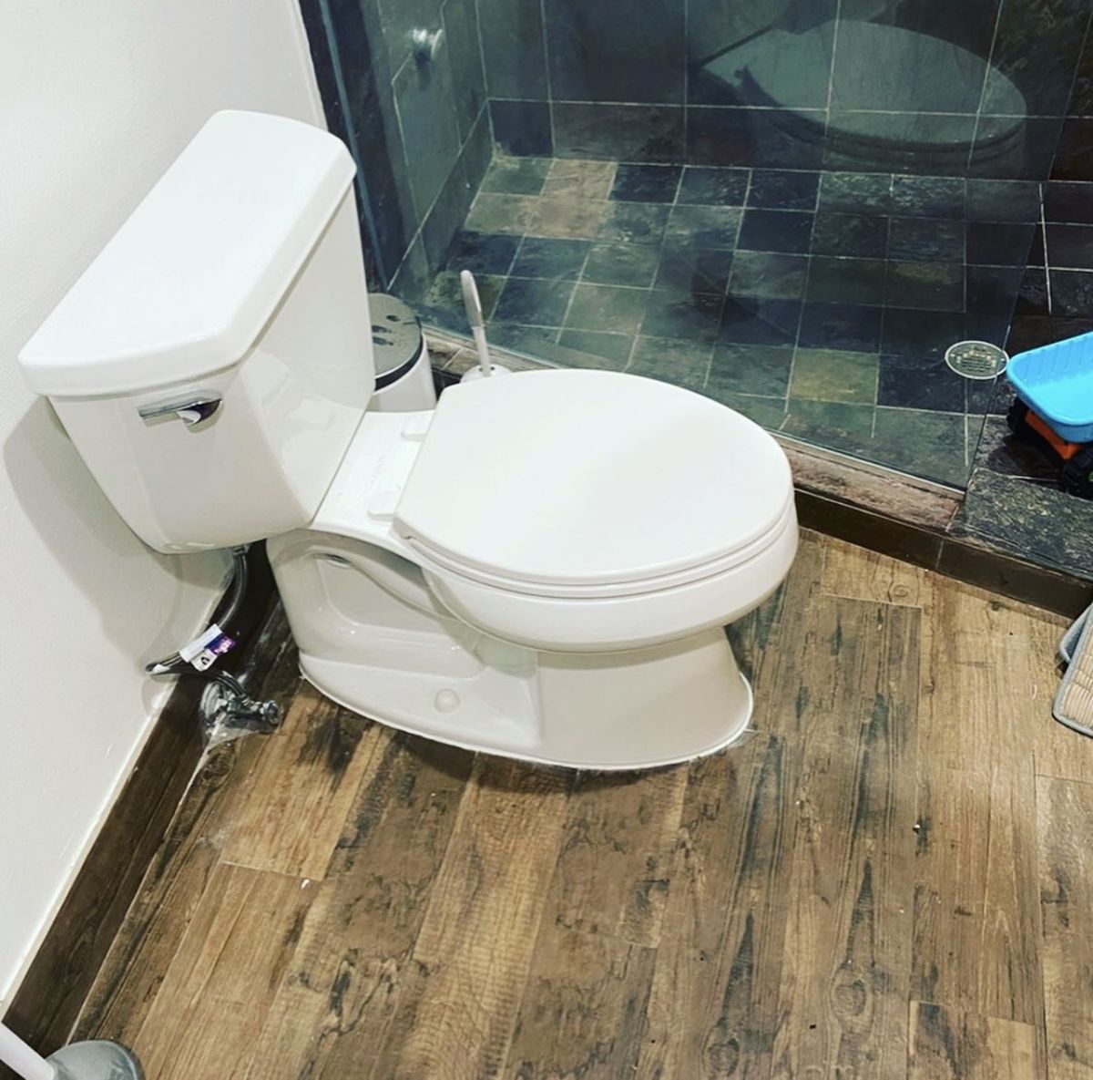 Finished job: new toilet installed in a bathroom